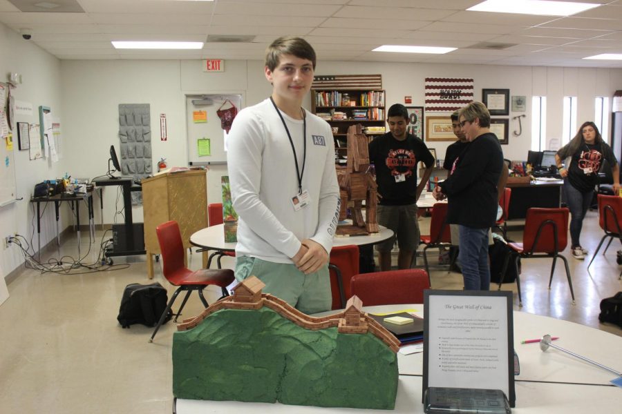 Sophomore Carl White stands with his model of the Great Wall of China