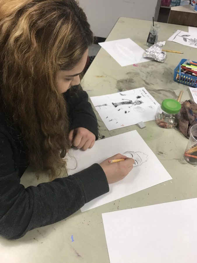 Senior Brenda Martinez works on recreating the doodle in her own style.