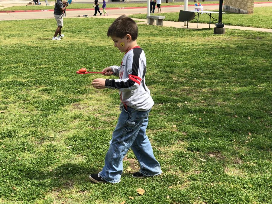 A student participates in the Egg Race. 