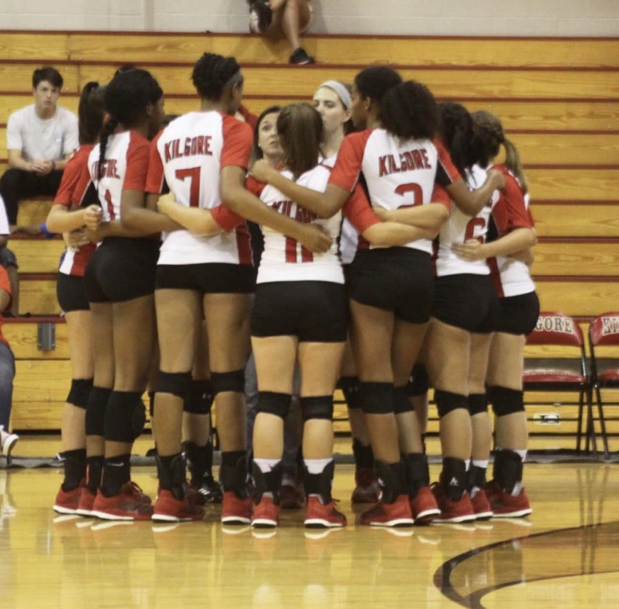 Varsity girls huddle during time-out.
