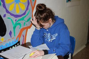 Junior Carlie Massey demonstrates how school and work can overwhelm students, leading to stress and mental breakdowns.  
