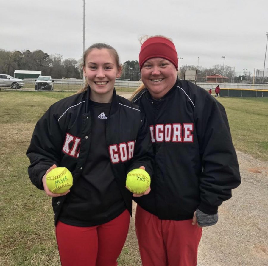 Coach+Kirkpatrick+and+sophomore+Bailey+Hedges+pose+with+her+home+run+softballs.++Courtesy+photo.%0A