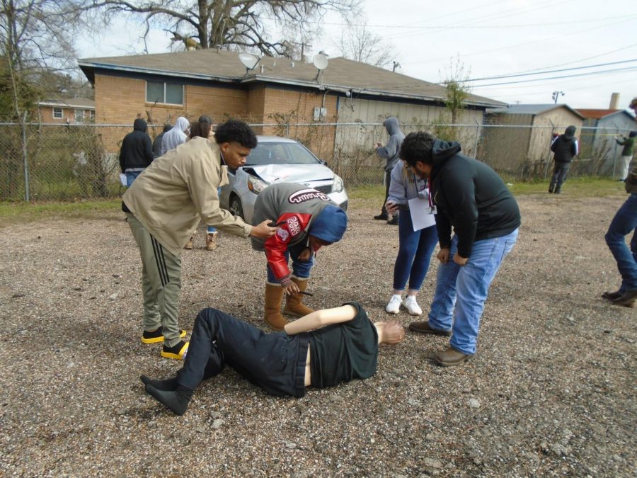 Seniors Tahzman Davis, Kaya Brown, and David Amaro group together to investigate the mock victim.