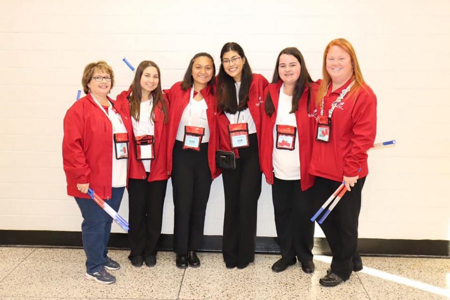 Jenny Baggett and Cheyenne Kirkpatrick pose with seniors Alison Rashidi, Sydney Chowdhury, Anushka Pradhan, and Mackenna Watkins at Skills USA competition.