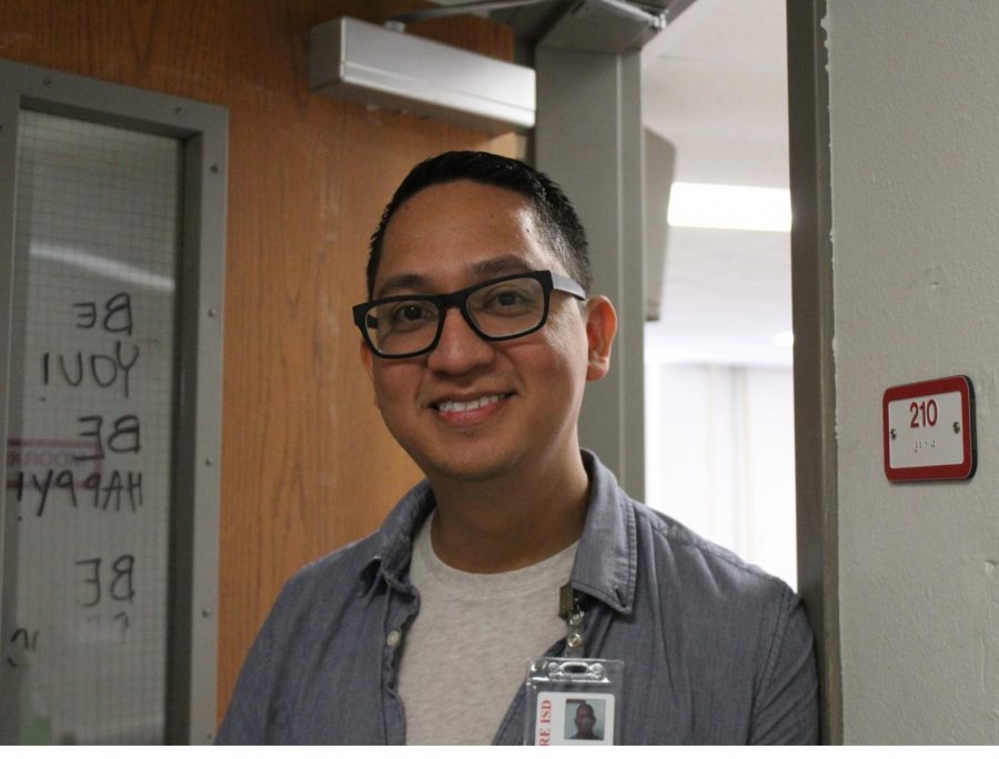 Angel Galvan smiles outside of his classroom.