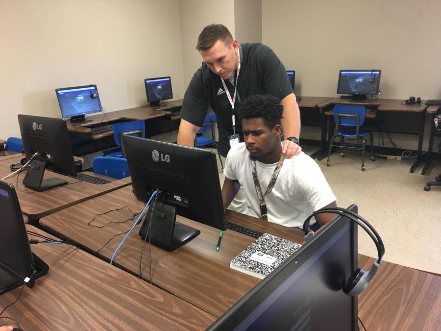 Coach Rosen assists student with his credit recovery work.