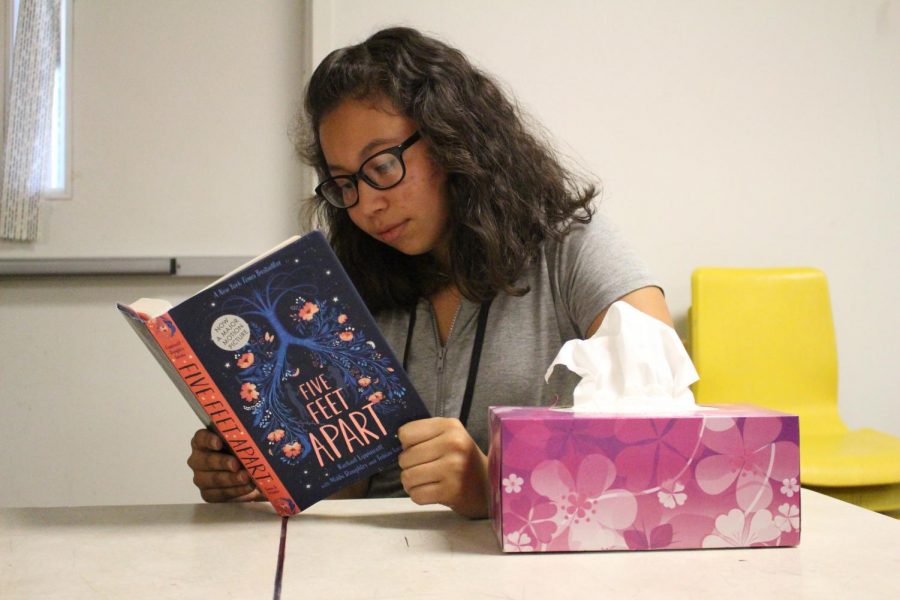 Sophomore Janette Chavez reads Five Feet Apart and has a tissue box just in case she cries. The book was released November 20. 2018 and the movie was released March 15, 2019. 