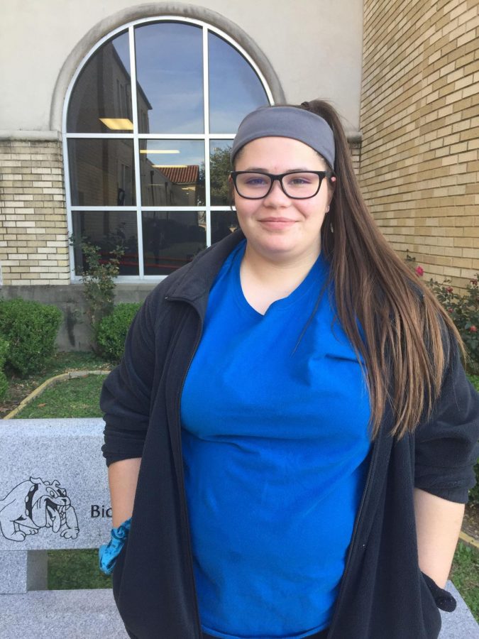 Sophomore Ariel Briggs smiles for the camera. She is about to leave school to head to work. Photo by Madison Donovan.