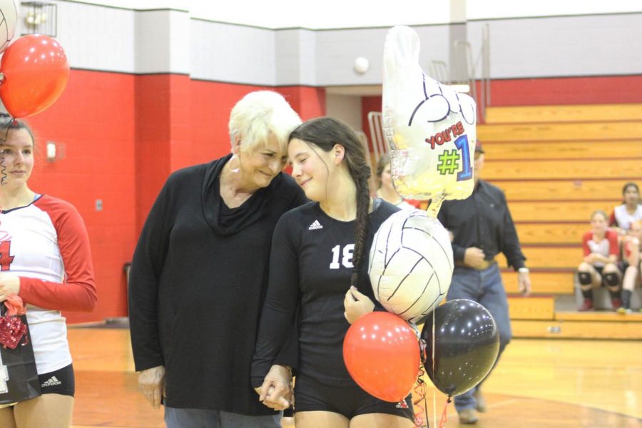 Senior+Skyler+Day+and+her+grandmother+Diana+McGlasson+share+a+moment+on+Senior+Night+for+the+volleyball+team.