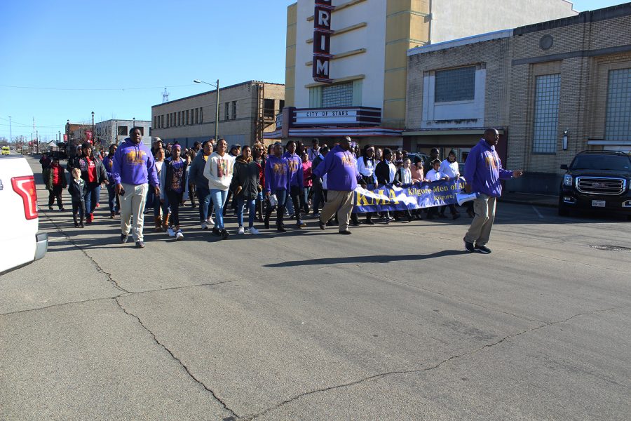 Community members marched in honor of Martin Luther King Jr.  while singing. 
