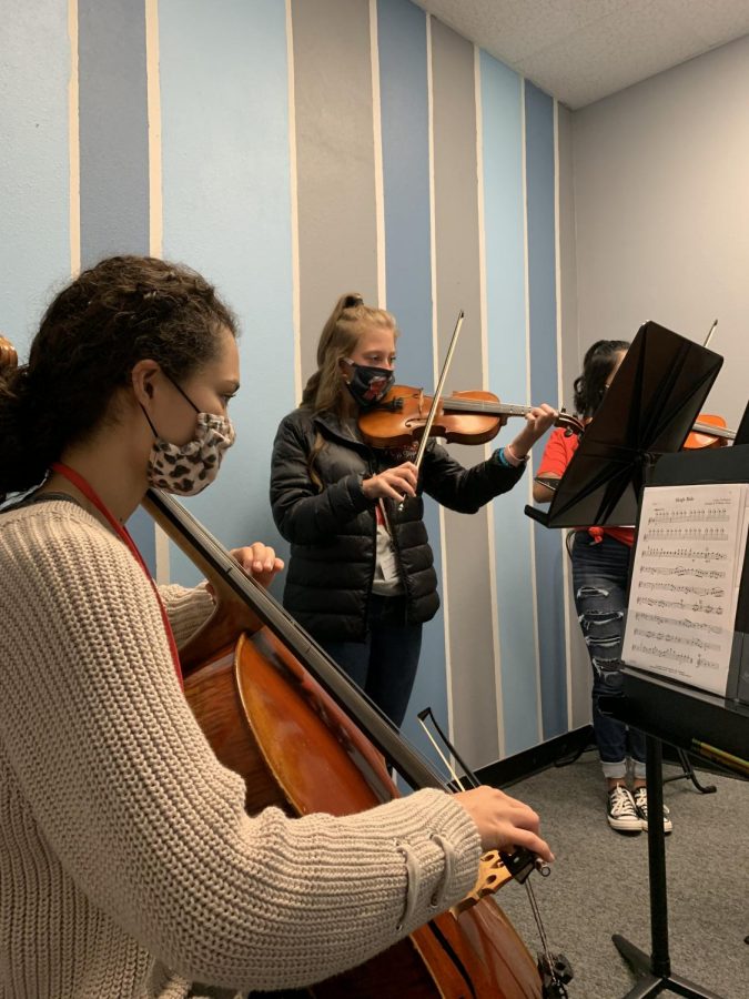 Junior Analyse Thomas, and freshmen Rylee Moore and Andrea Torres practice ensemble piece.