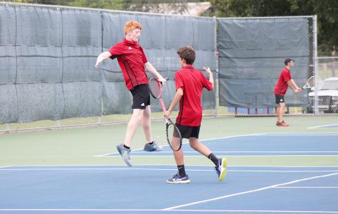 Sophomores Grayson Cavel and Drew Adamez celebrate after a successful match.