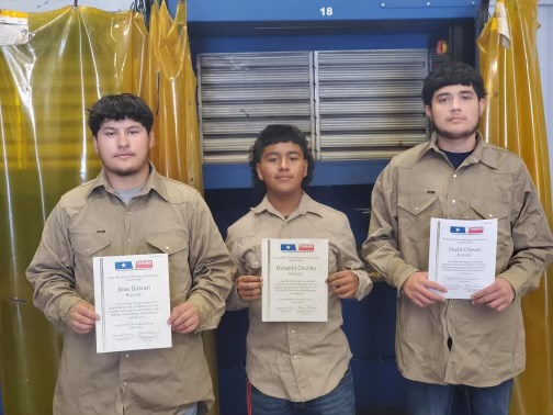 Senior Daniel Galvan, sophomore Osbaldo Castillo, and junior David Chavez show off their certifications. 