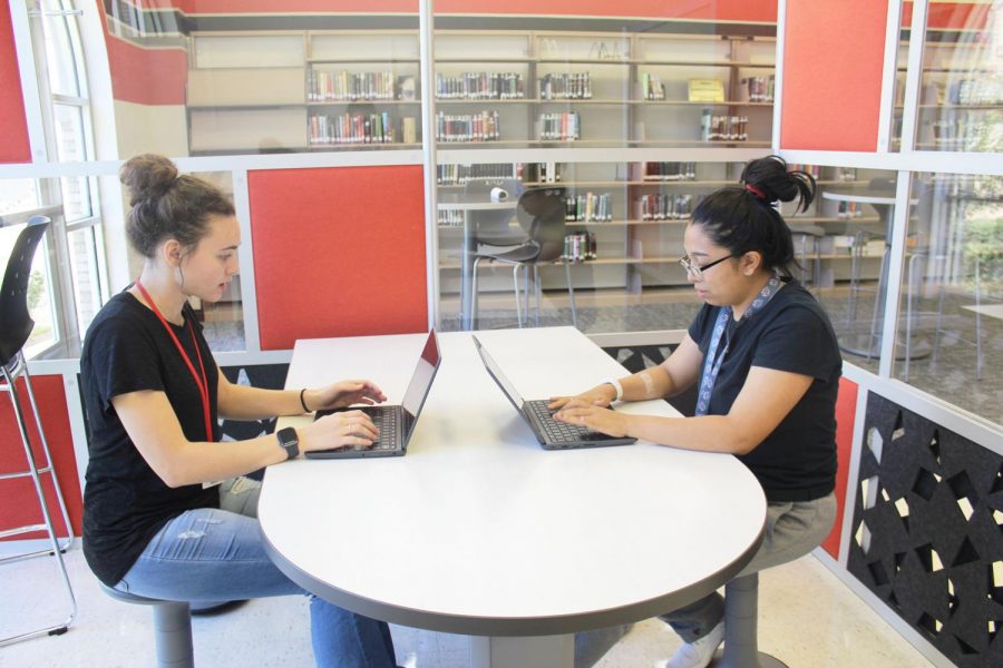 Seniors Eryka Hopper and Kendall Trevino work on a project together inside one of the new rooms within the library. “I like that I was able to get away from the rush of the class to work,” Trevino said. “I didn’t get distracted by all of the conversations around me.”