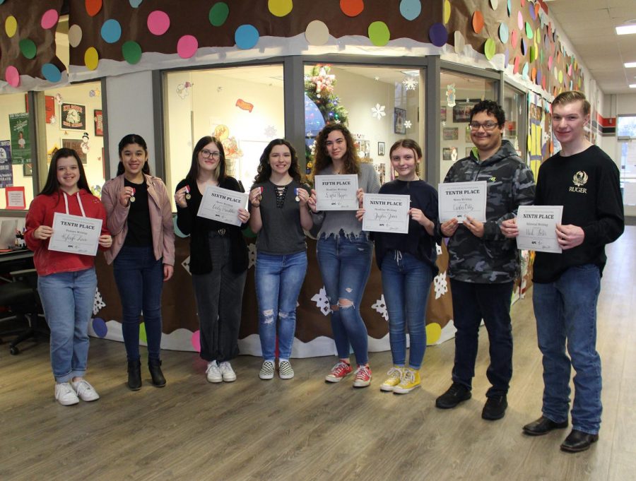 Participants in the UIL Journalism CenTex meet show off their medals and certificates. There are three first place winners who received medals, and all other placements received a certificate. 