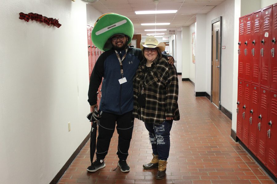 Sophomore Xsavier Ortiz and CTE teacher Amy Bates proudly showing their hats to support Kai Tucker.
