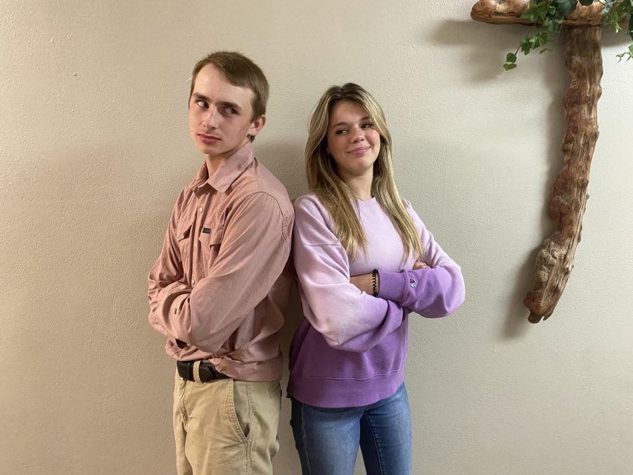 “Uniforms are not it!”• Kenneth Exline in a red uniform shirt and khakis is pictured with Emma Kate Bailey in her everyday clothes. Photo by Lou Carlisle.