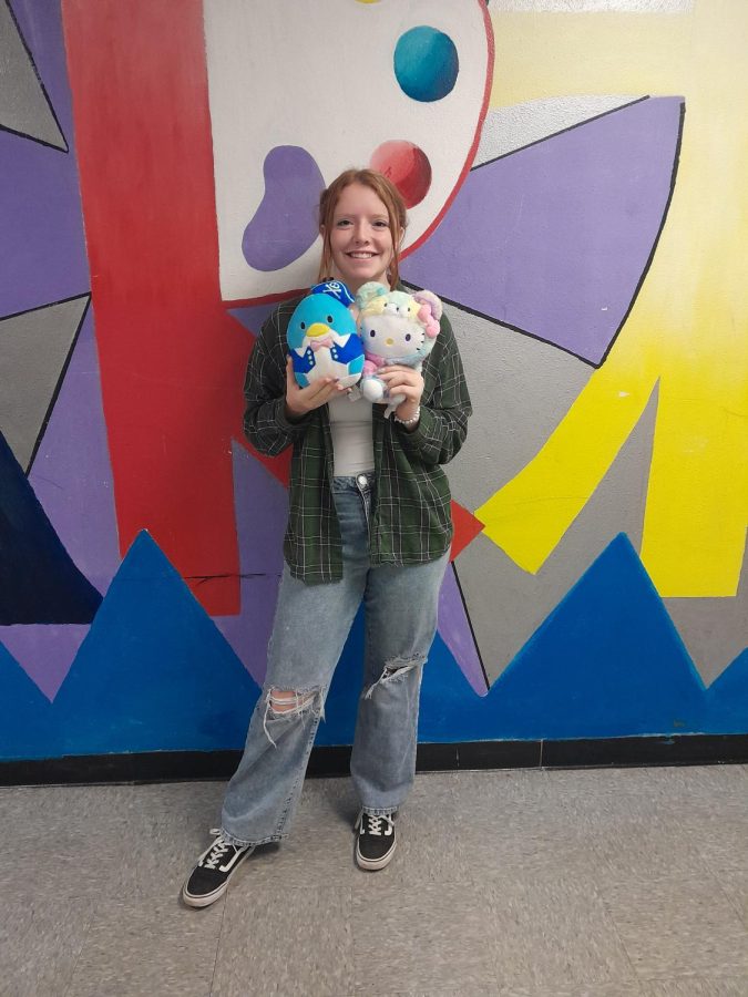 Cute plushies • Sophomore Lainy Bodine poses with her favorite Sanrio characters. 