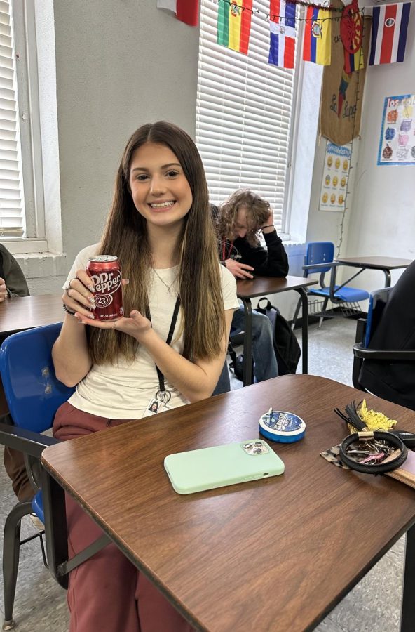 Quenches+thirst+with+a+Dr.Pepper+%E2%80%A2+Junior+Breanna+West+sips+on+her+daily+Dr.+Pepper+to+get+her+through+class.+Photo+by+Selena+Andrade.+