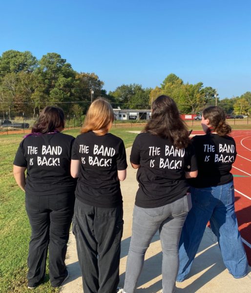 Band students show their KHS Band pride by showing off the new band shirts.