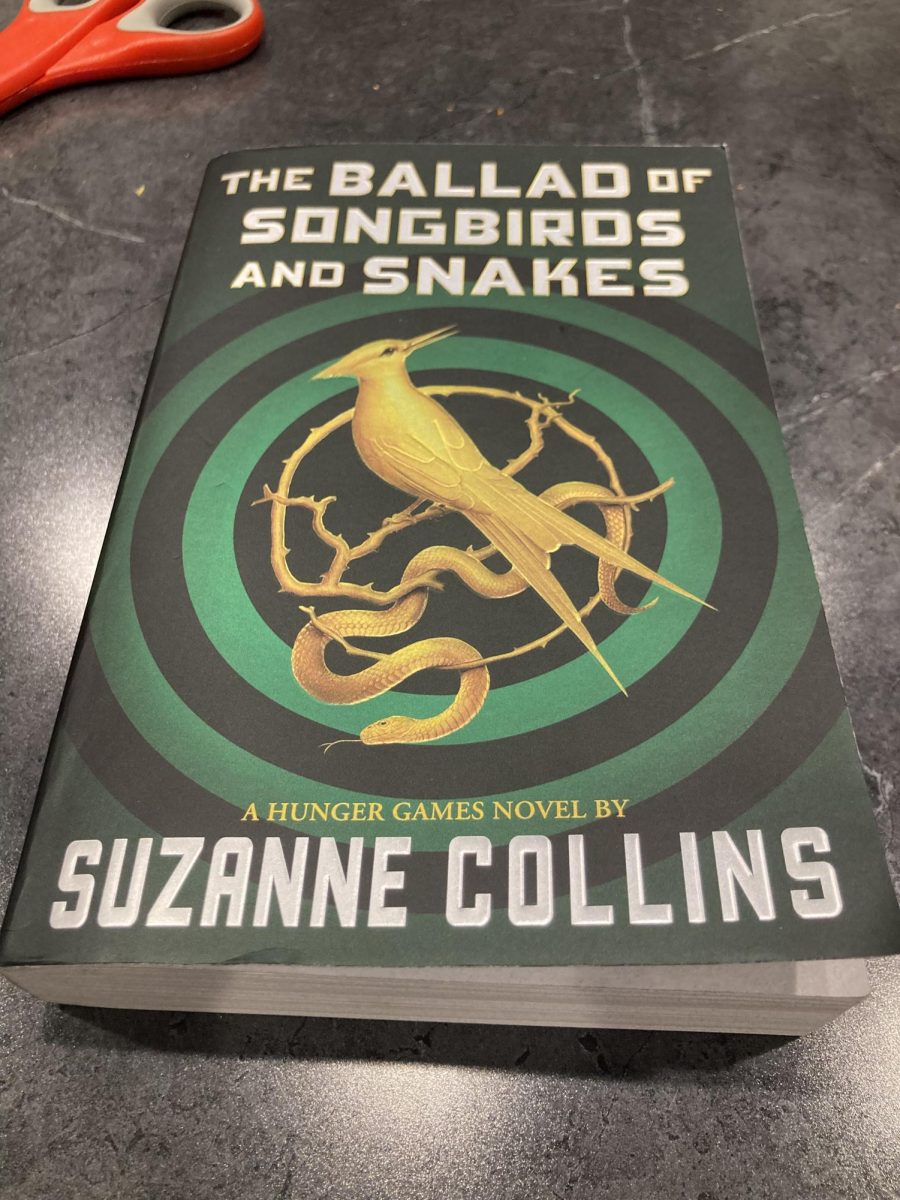 The Ballad of Songbirds and Snakes movie is based on this book by Suzanne Collins. If youre the type of person who enjoys reading books before movies, then look for this at your local library!