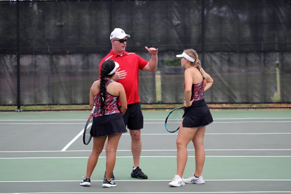 Coach Maroney gives advice to Mari Composano and Tera Ferguson during their match
