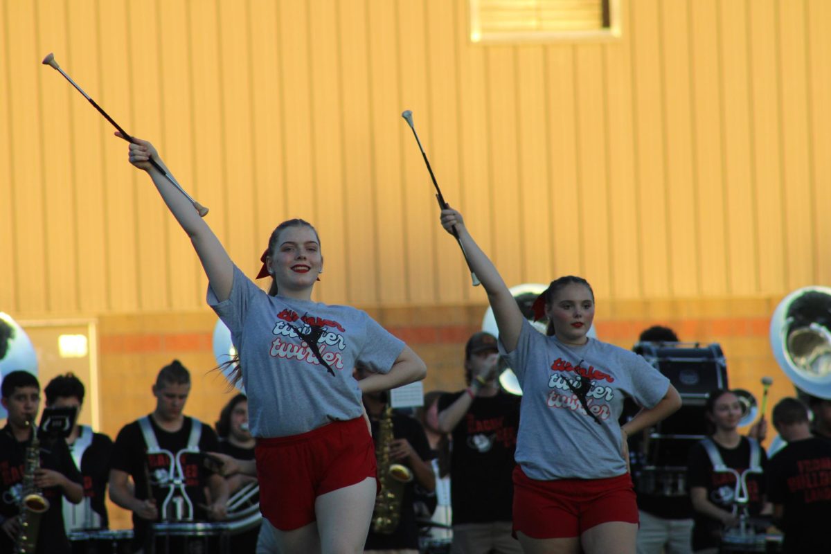 Sophomore Janey Hurtt and Freshman Jordan Blair enact a twirl recital for the Watermelon Festival.