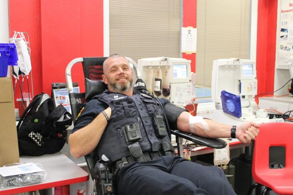 SRO Sergeant Josh Vercher giving blood at the October 31st blood drive.