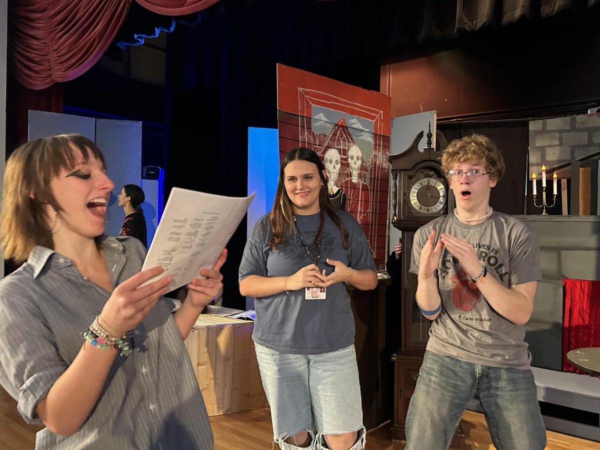 Sophomore Lona Cole, junior Symphony Forbus, and junior Seth Hardin run through the witch's lair scene.