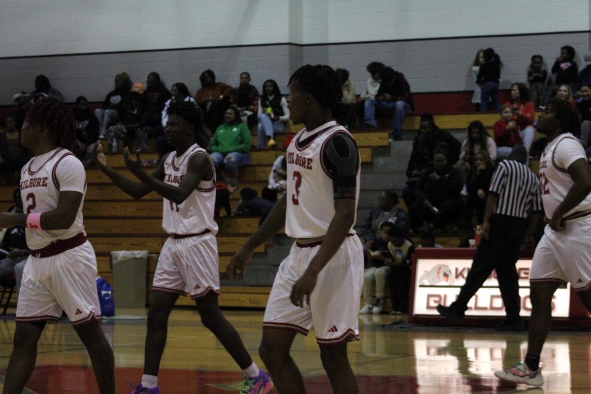 Seniors JT Towns, Jacory Walton and junior Kayson Brooks have their eyes set on the court.