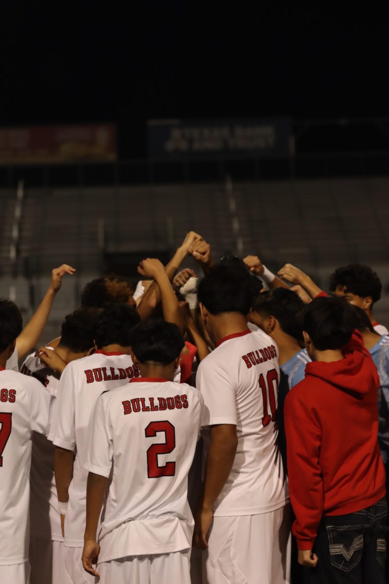 Soccer boys do pre-game tradition to hype each other up.